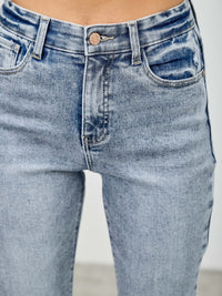 High Rise Kick Flare With Rhinestone high-rise jeans featuring a stylish denim design and flattering fit.