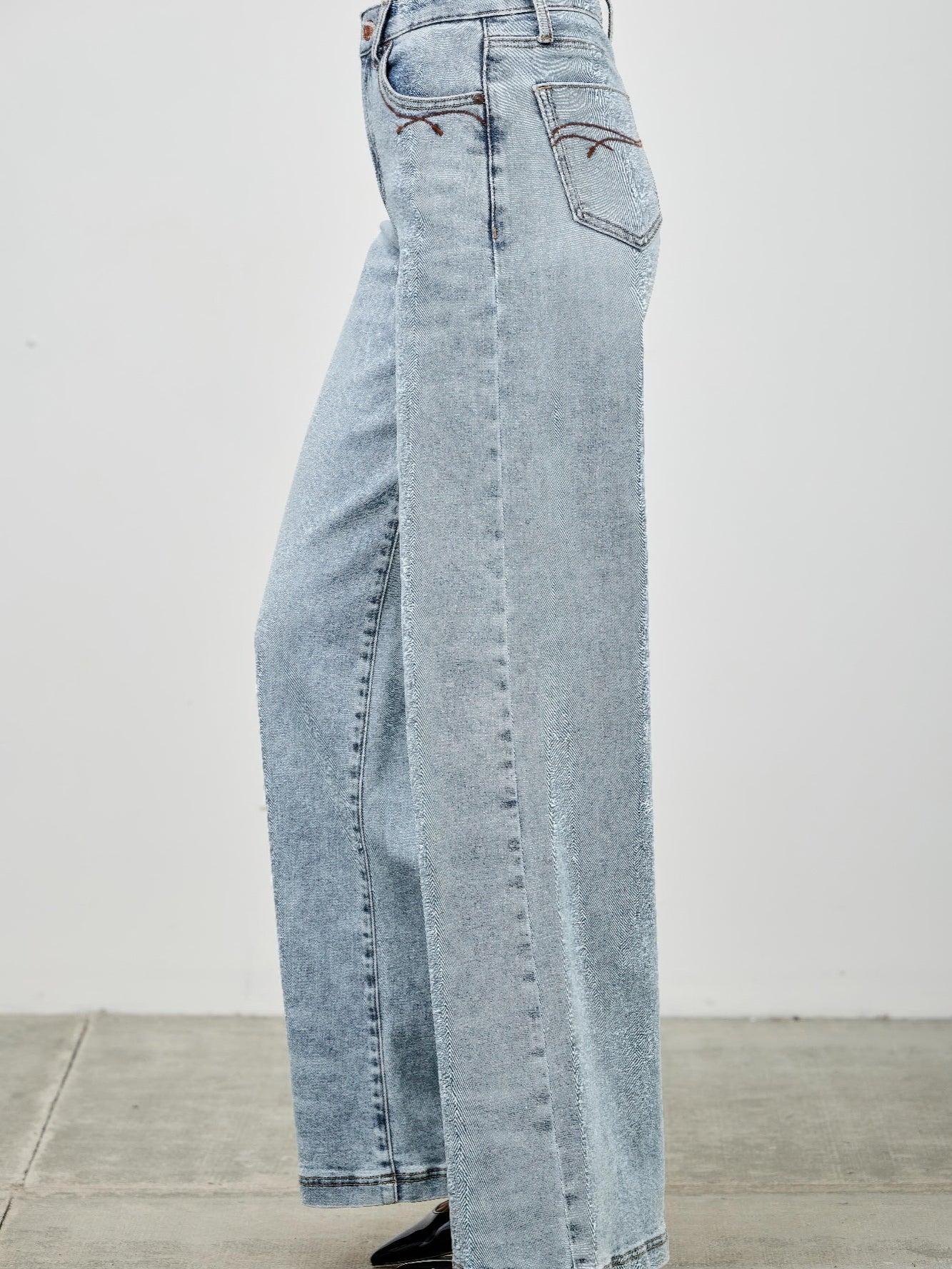 High Rise Wide Leg jeans in light wash with a relaxed fit and five-pocket styling.