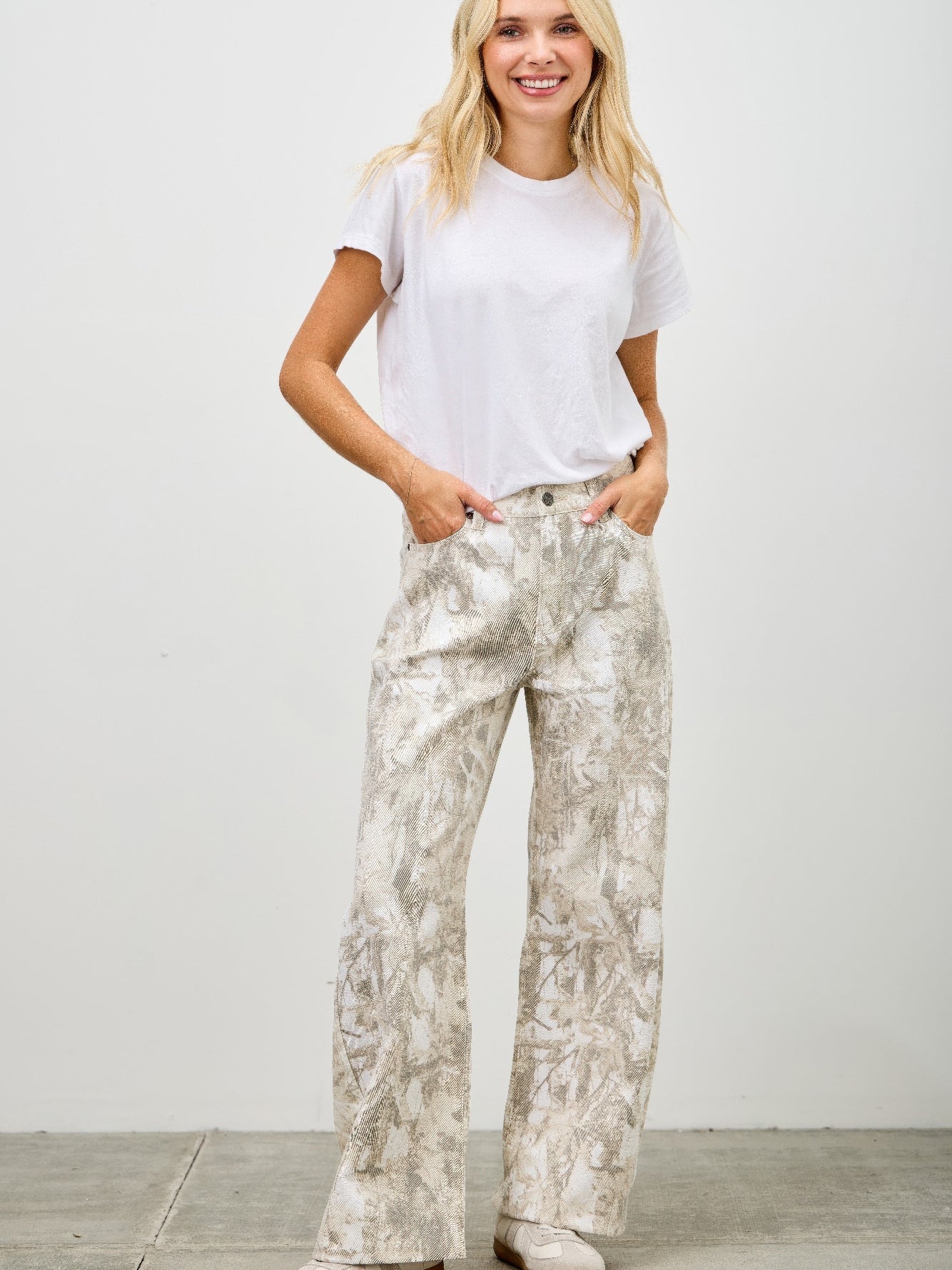 Model wearing High Rise Low Curve Barrel jeans with an eye-catching design and contemporary silhouette.