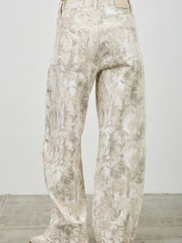 High Rise Low Curve Barrel jeans showcasing a unique printed design and high-rise waist, viewed from the back.