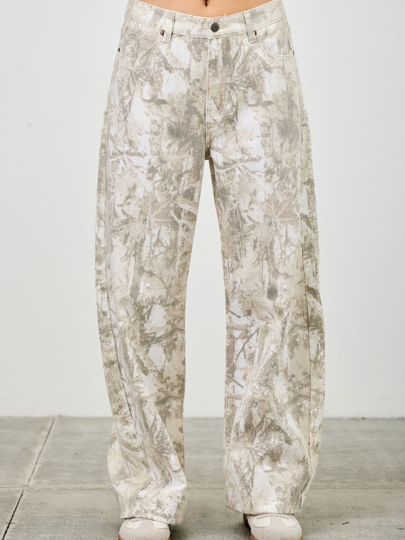 High Rise Low Curve Barrel jeans featuring a unique printed design and contemporary wide-leg silhouette.
