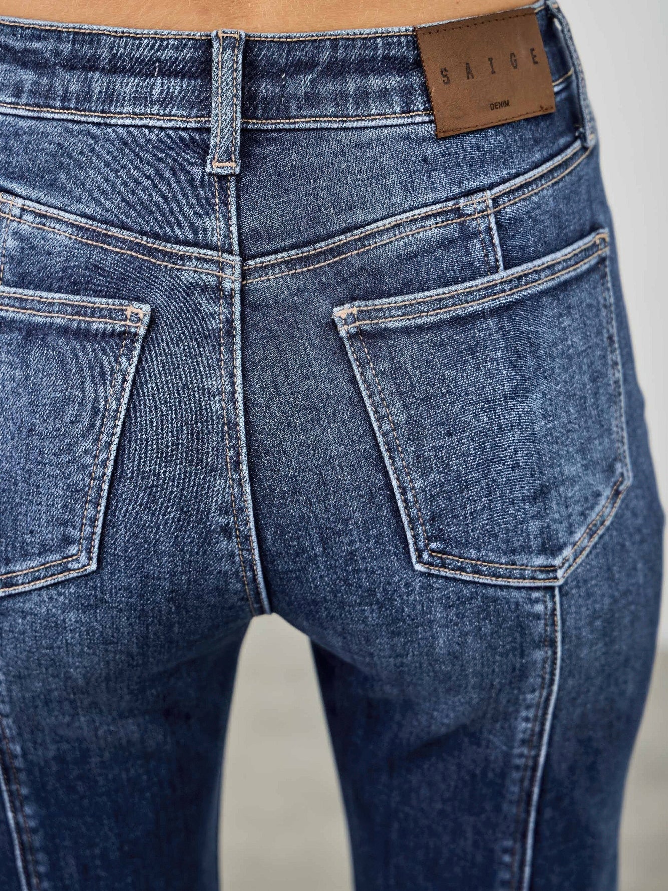 High Rise Boot Cut With Seam Detail back view showcasing the pocket and seam details on stretchy denim jeans.