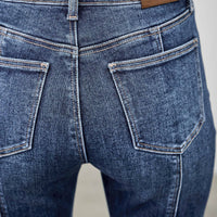 High Rise Boot Cut With Seam Detail back view showcasing the pocket and seam details on stretchy denim jeans.
