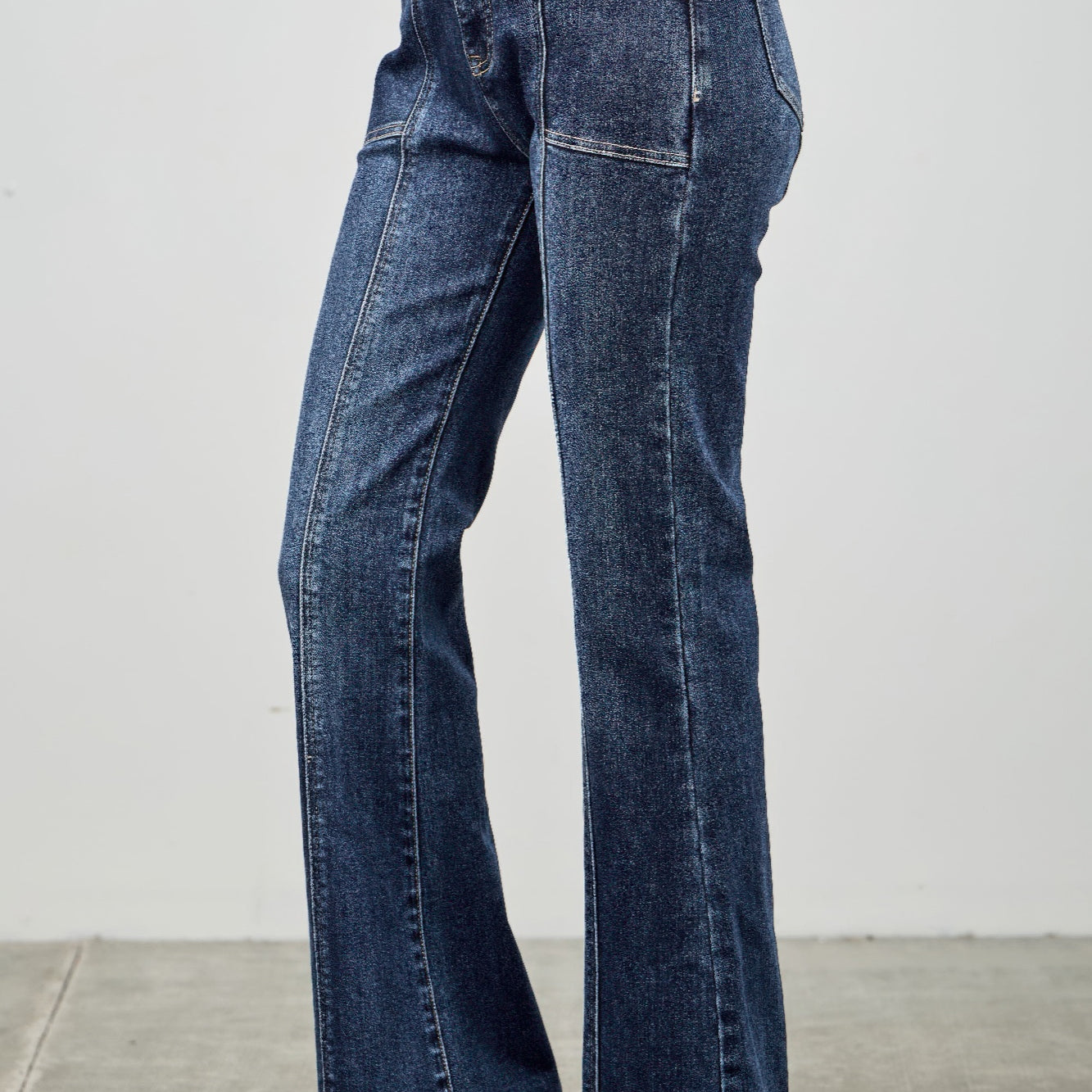 High Rise Boot Cut With Seam Detail displayed in dark denim, featuring a flattering high-rise fit and stylish seam details.