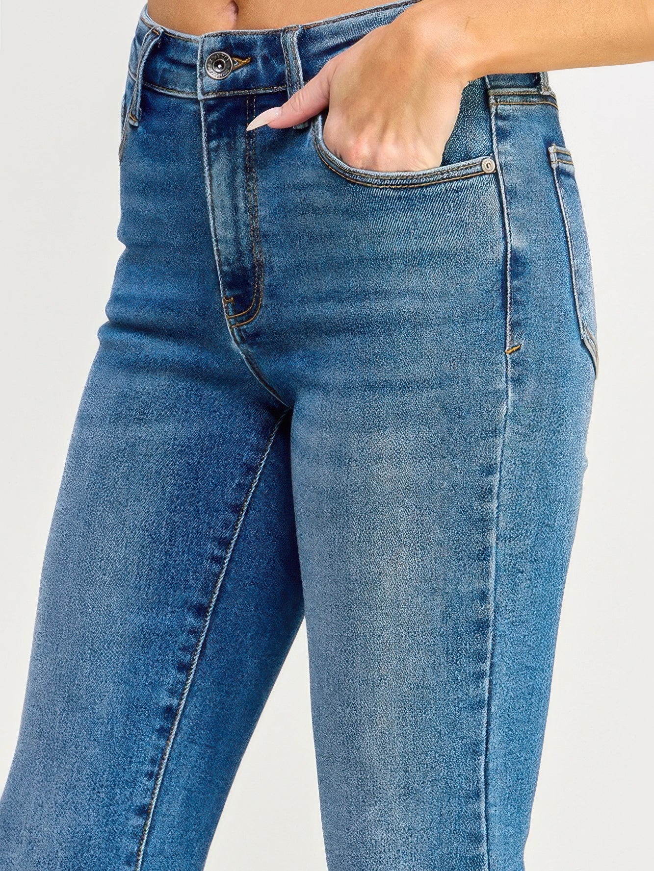 Tummy Control Mid Rise Skinny Bootcut jeans showcasing a flattering fit with a mid-rise waist and soft stretch denim.