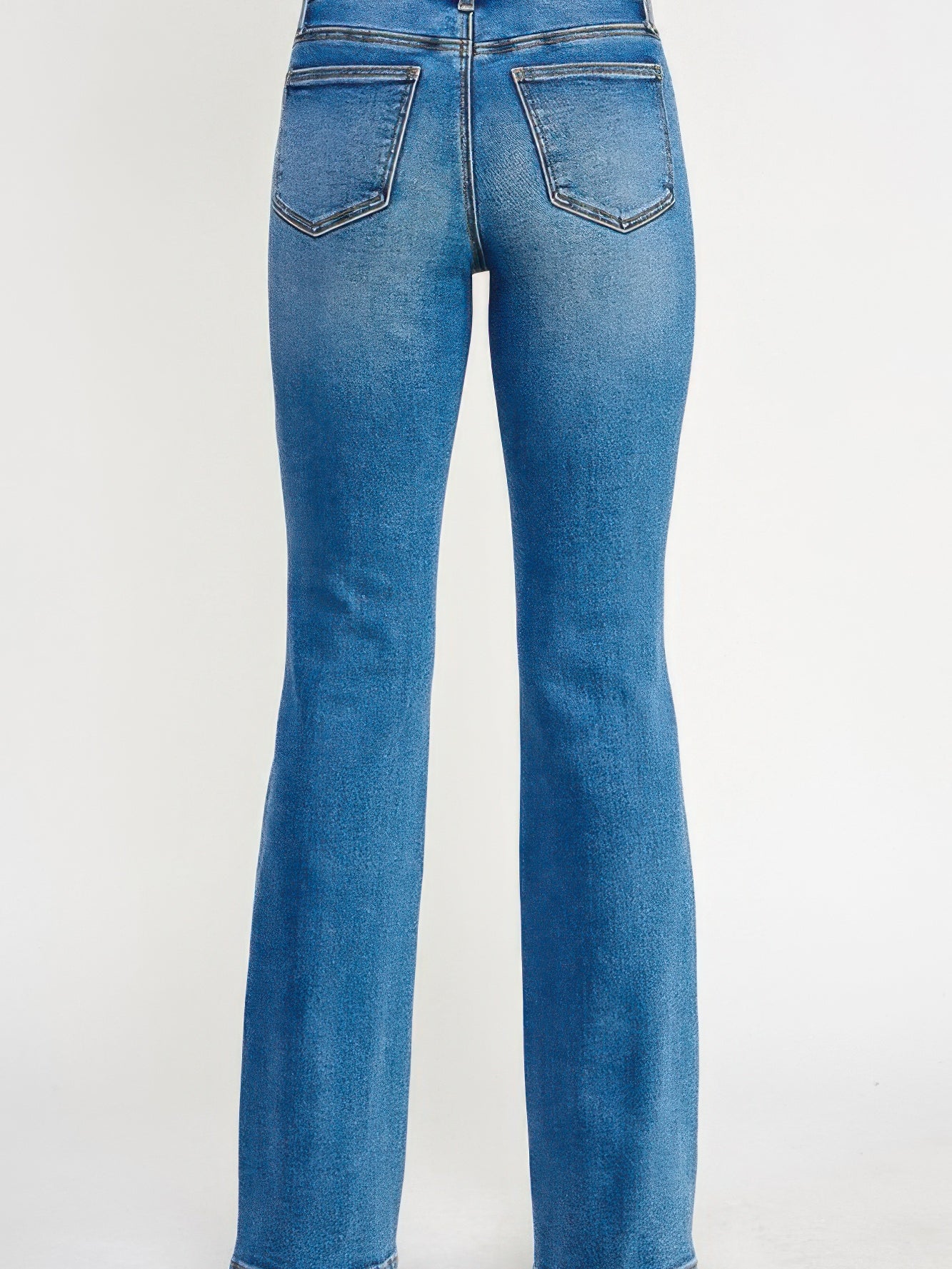 Back view of Tummy Control Mid Rise Skinny Bootcut jeans showcasing the flattering bootcut silhouette.