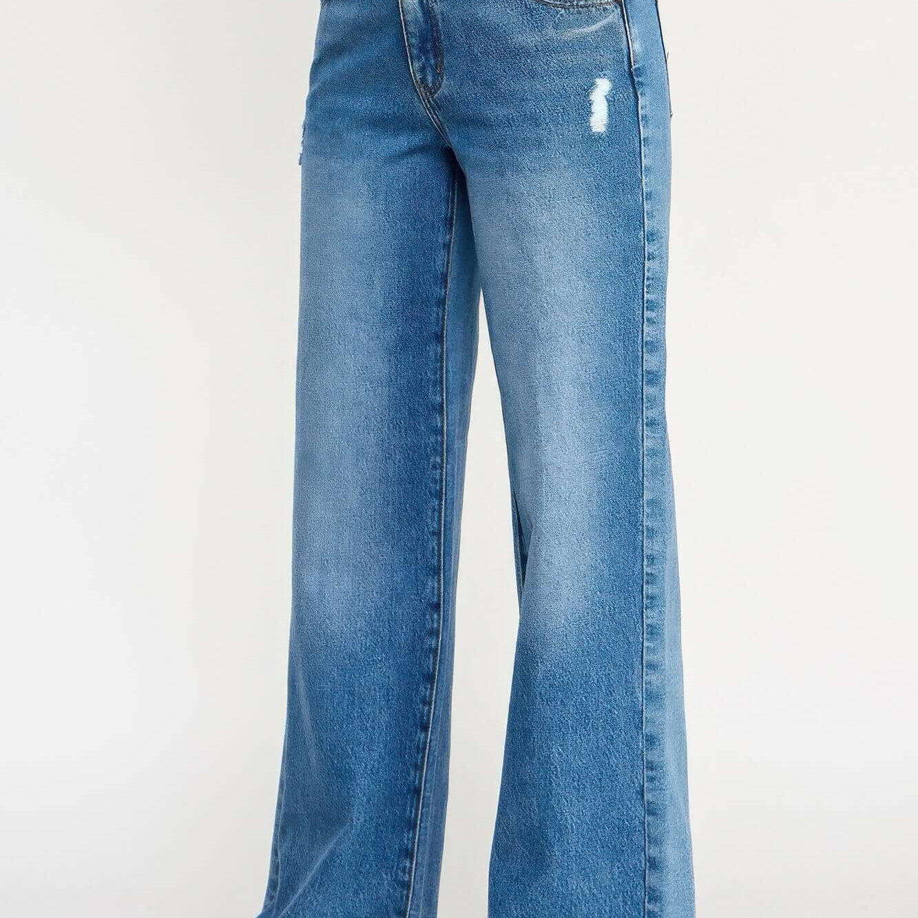 High Rise Double Waist Wide Leg jeans in light wash with a wide leg cut and distressed details.