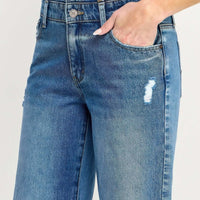 Close-up of High Rise Double Waist Wide Leg jeans showcasing double waistband and stylish distressing details.