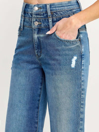 Close-up of High Rise Double Waist Wide Leg jeans showcasing double waistband and stylish distressing details.