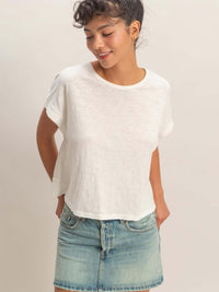 Acid Washed Cross Detail Open Back Top worn with a casual denim skirt, featuring a relaxed fit and soft fabric.
