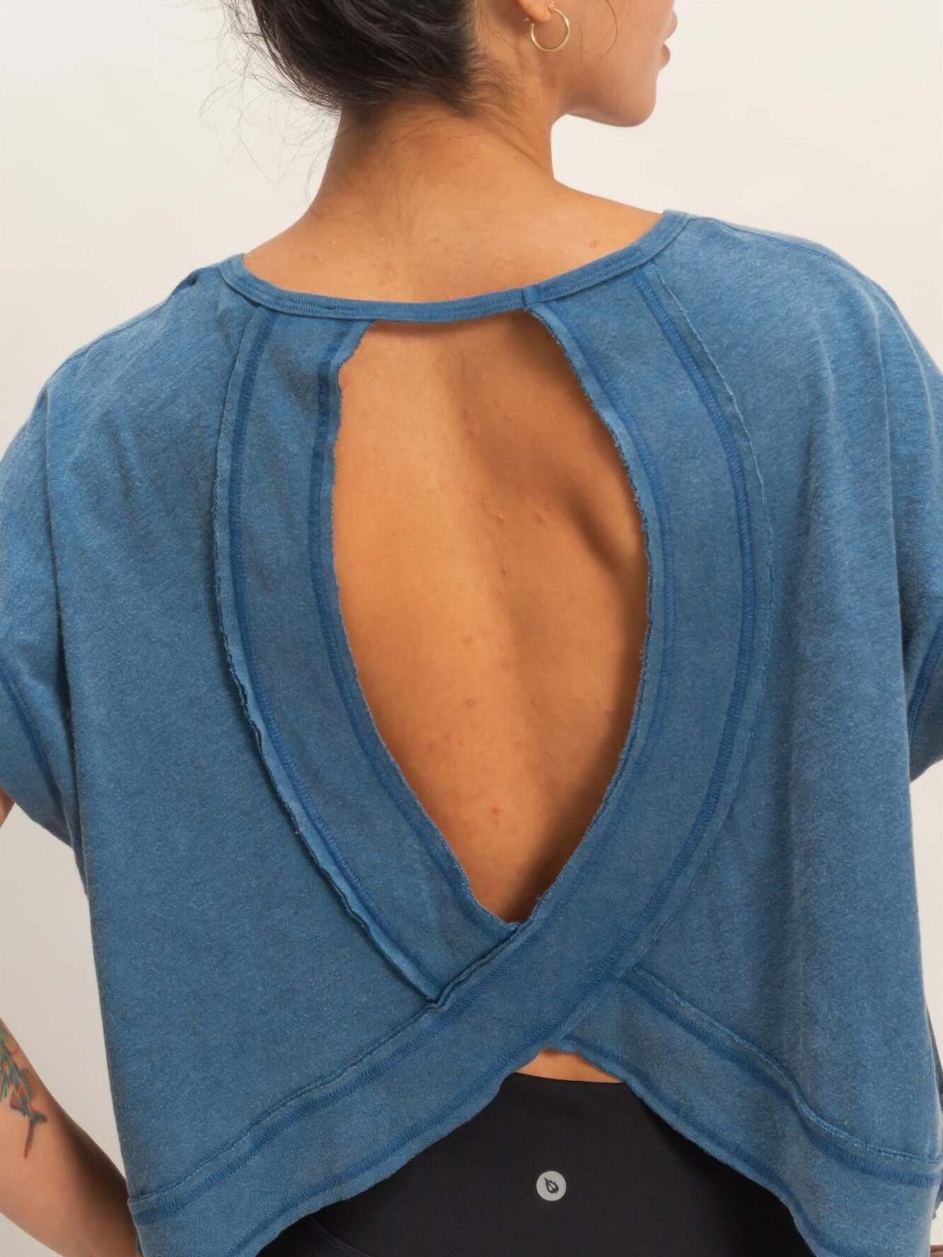 Acid Washed Cross Detail Open Back Top showcasing a modern silhouette with a unique open back design.