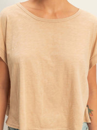 Acid Washed Cross Detail Open Back Top displayed on model with a light beige color and relaxed fit.