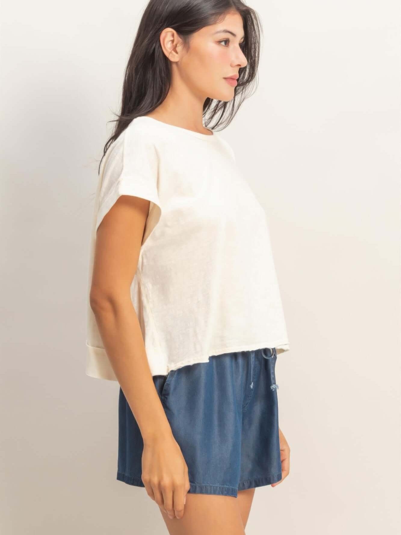 Acid Washed Cross Detail Open Back Top worn by a model, showcasing side profile and casual summer style.