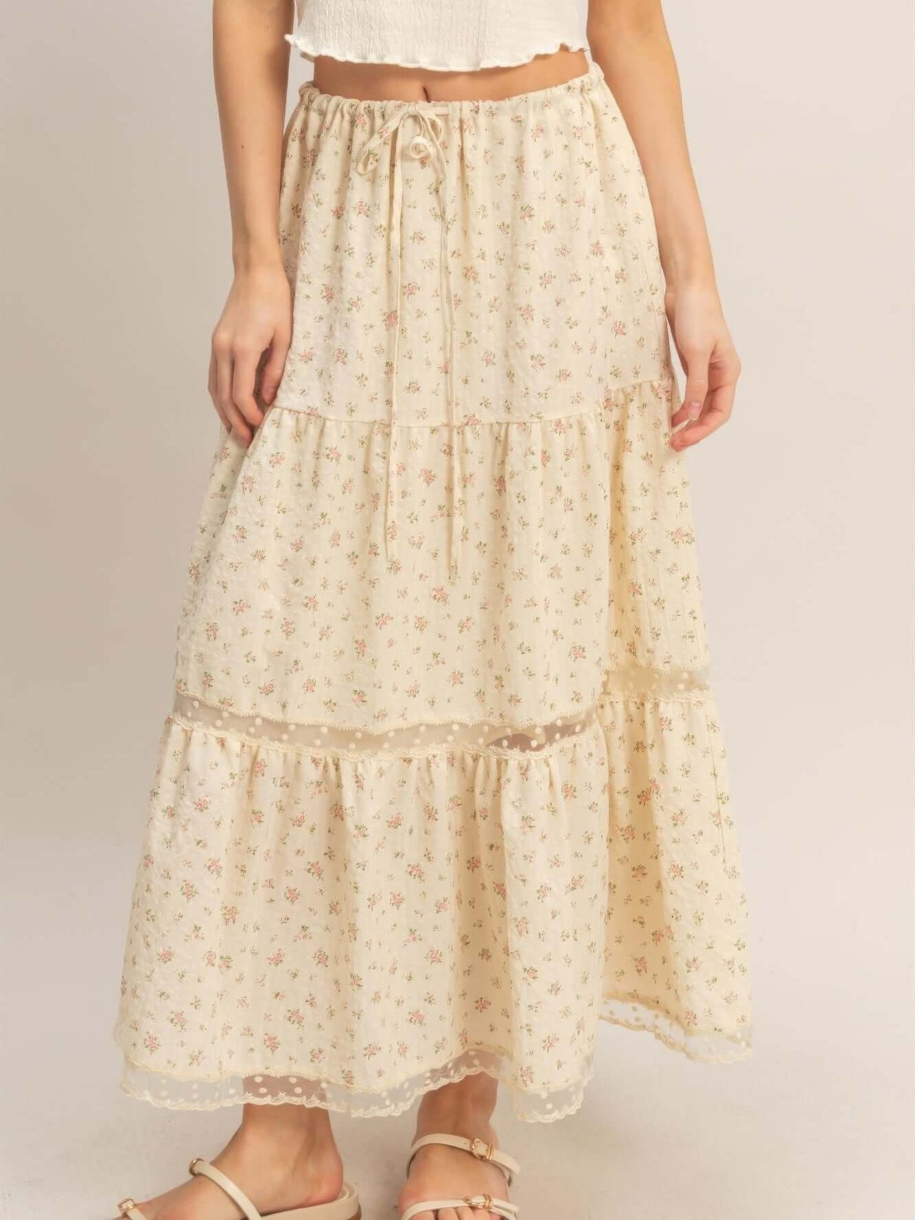 Stylish model wearing a Tiered Lace Trim Skirt with floral patterns and delicate lace details.