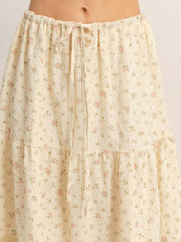 Tiered Lace Trim Skirt featuring a floral pattern, adjustable drawstring waistband, and lightweight flowy design.