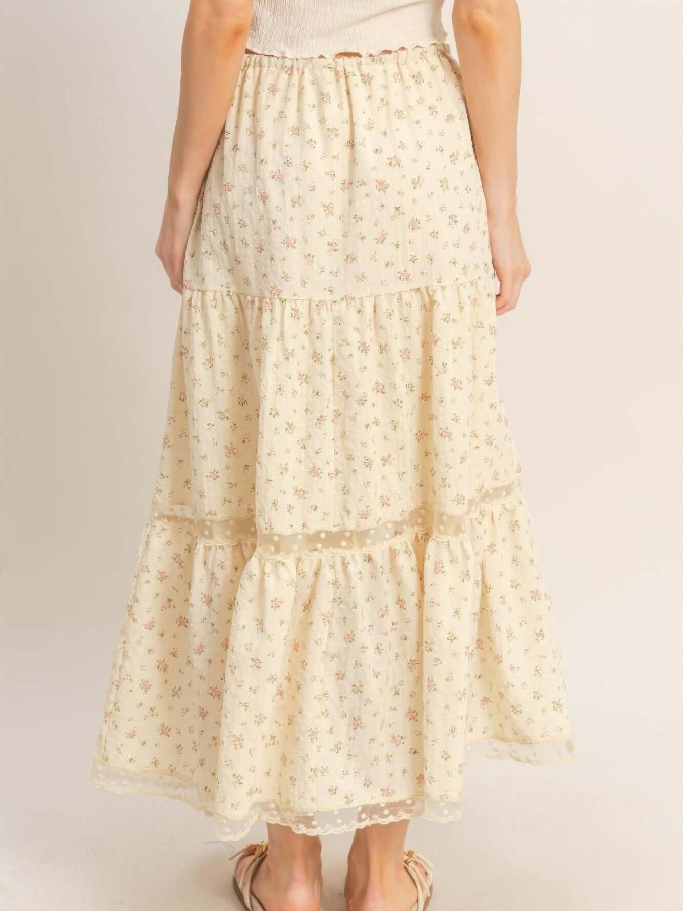 Back view of the Tiered Lace Trim Skirt featuring a floral pattern and flowing silhouette.