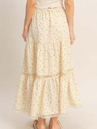 Back view of the Tiered Lace Trim Skirt featuring a floral pattern and flowing silhouette.