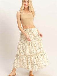 A model wearing a Tiered Lace Trim Skirt paired with a fitted top, showcasing the skirt's flowing silhouette and lace details.