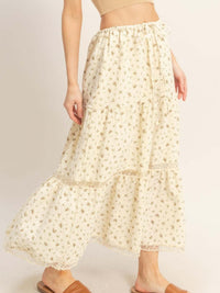 Model wearing a Tiered Lace Trim Skirt with floral print and adjustable waistband, showcasing its lightweight, flowing material.