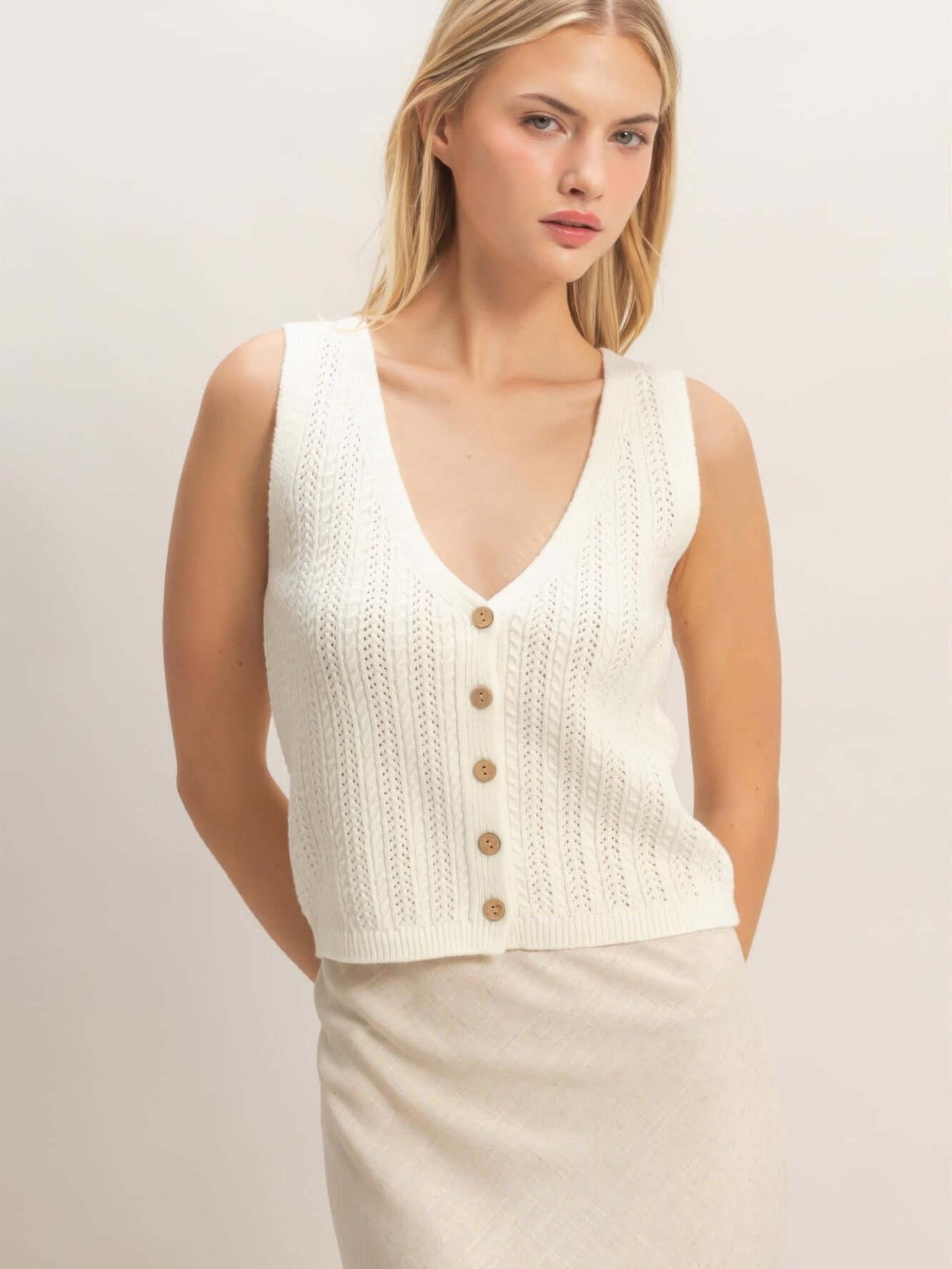 V-neck Knit Tank Top featuring a soft cotton-blend knit with a button-front closure and flattering V-neckline.
