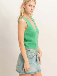 V-neck Knit Tank Top in vibrant green with button-front closure and ribbed texture, styled with a denim skirt.