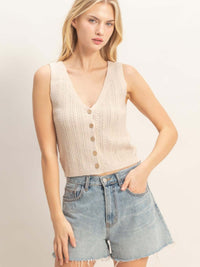 V-neck Knit Tank Top in soft beige with button closure, styled with denim shorts for a casual look.