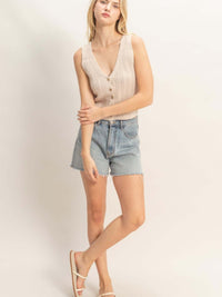 V-neck Knit Tank Top styled with denim shorts, showcasing a button-front closure and a flattering V-neckline.