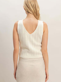 Back view of a V-neck Knit Tank Top, showcasing its textured design and flattering fit.
