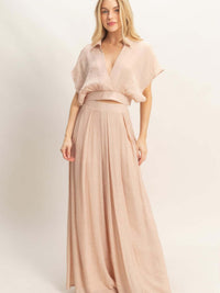 Model showcasing a Collared Wrap Top & Wide-leg Pants Set in soft pink fabric for a sophisticated look.