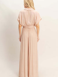 Back view of a woman wearing a Collared Wrap Top & Wide-leg Pants Set in soft pink fabric.