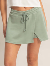 Wrap Front Elastic Waist Skort in soft green fabric with adjustable waist and stylish wrap design.