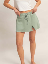 Wrap Front Elastic Waist Skort with adjustable elastic waistband in soft green fabric, perfect for activewear.