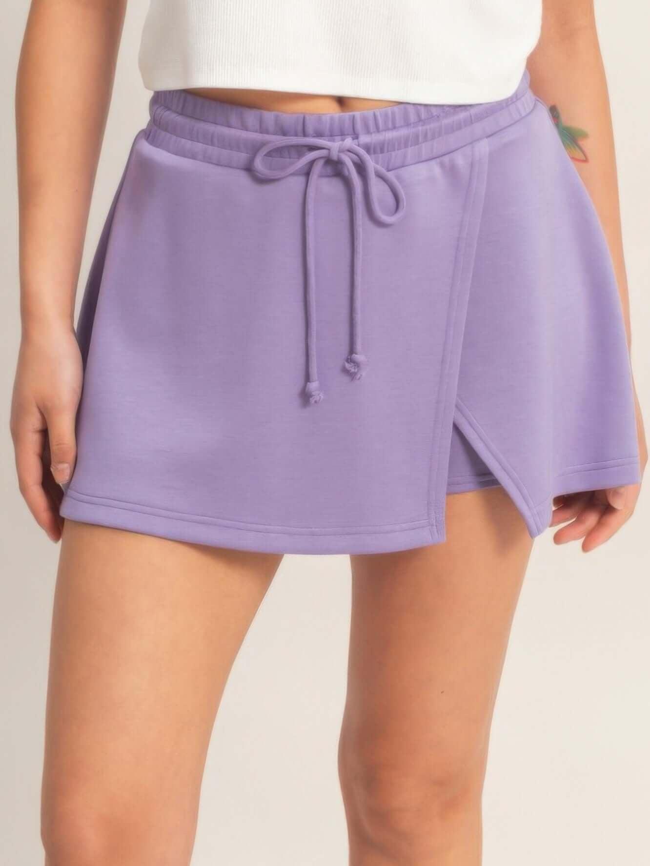 Wrap Front Elastic Waist Skort in lavender with adjustable waist and stylish wrap detail for active wear.