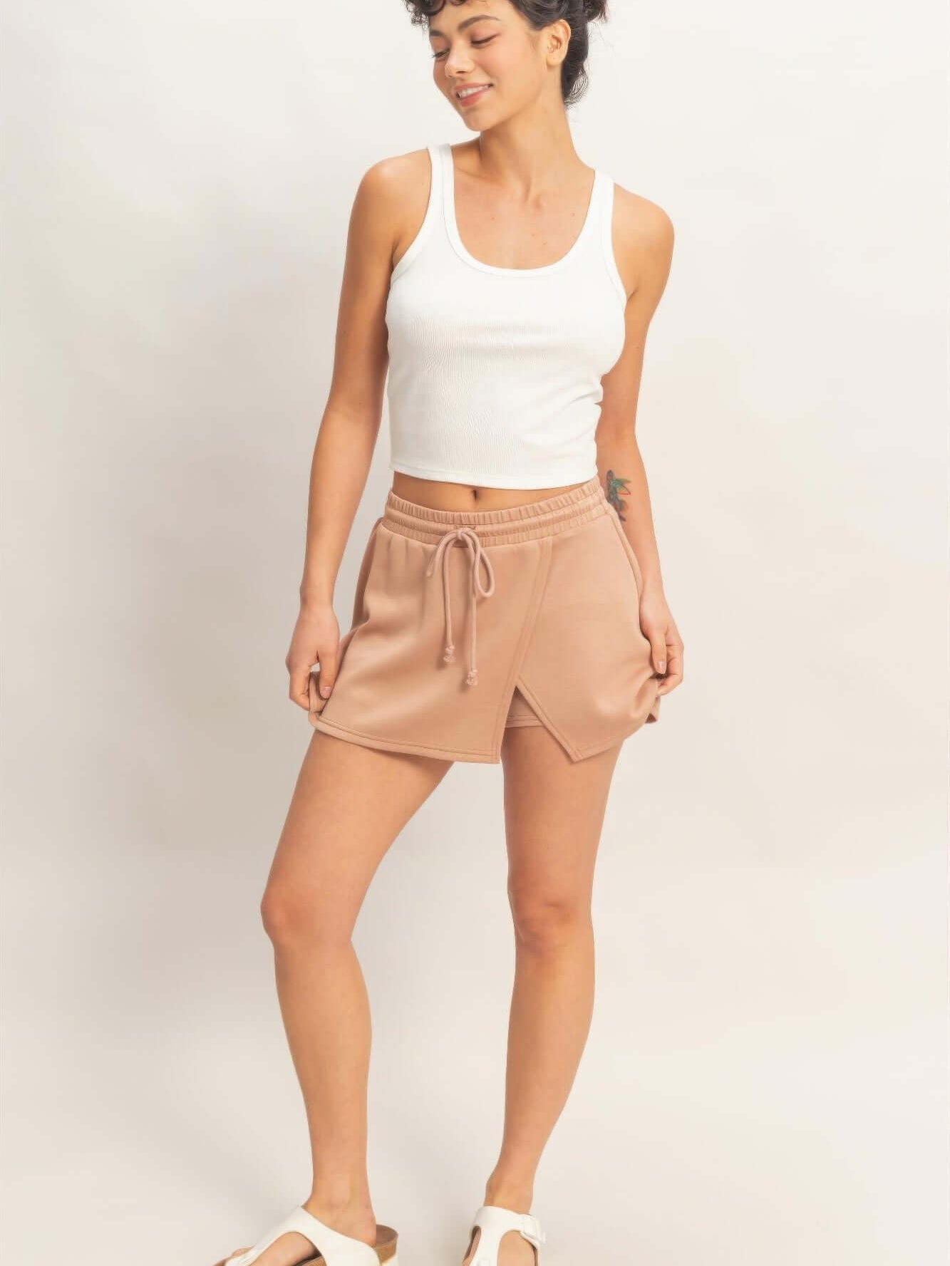 Wrap Front Elastic Waist Skort displayed on a model, showcasing its stylish design and comfortable fit.
