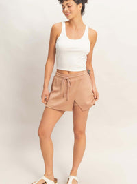 Wrap Front Elastic Waist Skort displayed on a model, showcasing its stylish design and comfortable fit.