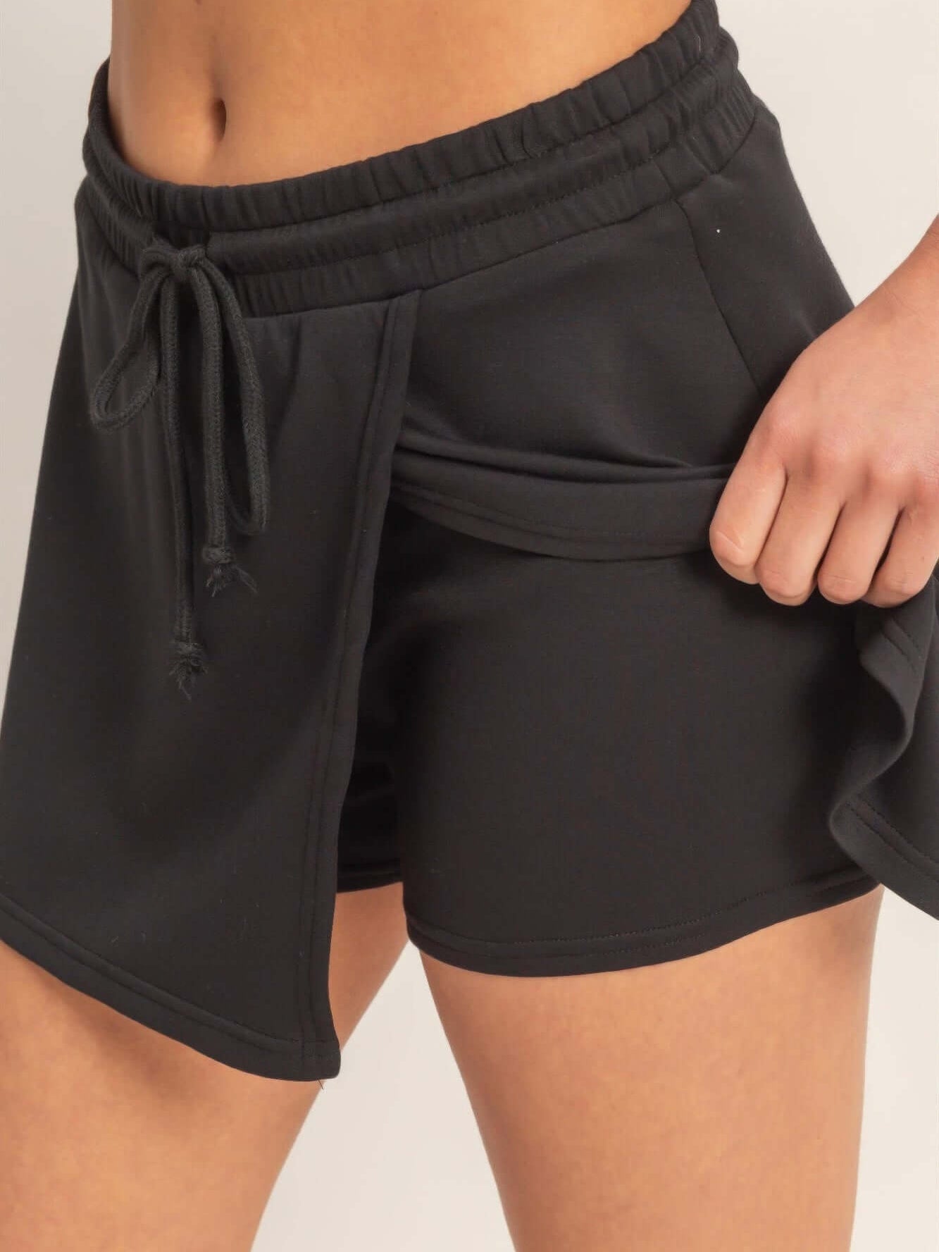 Wrap Front Elastic Waist Skort featuring a comfortable elastic waistband and stylish wrap detail for active wear.