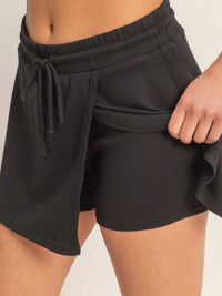Wrap Front Elastic Waist Skort featuring a comfortable elastic waistband and stylish wrap detail for active wear.