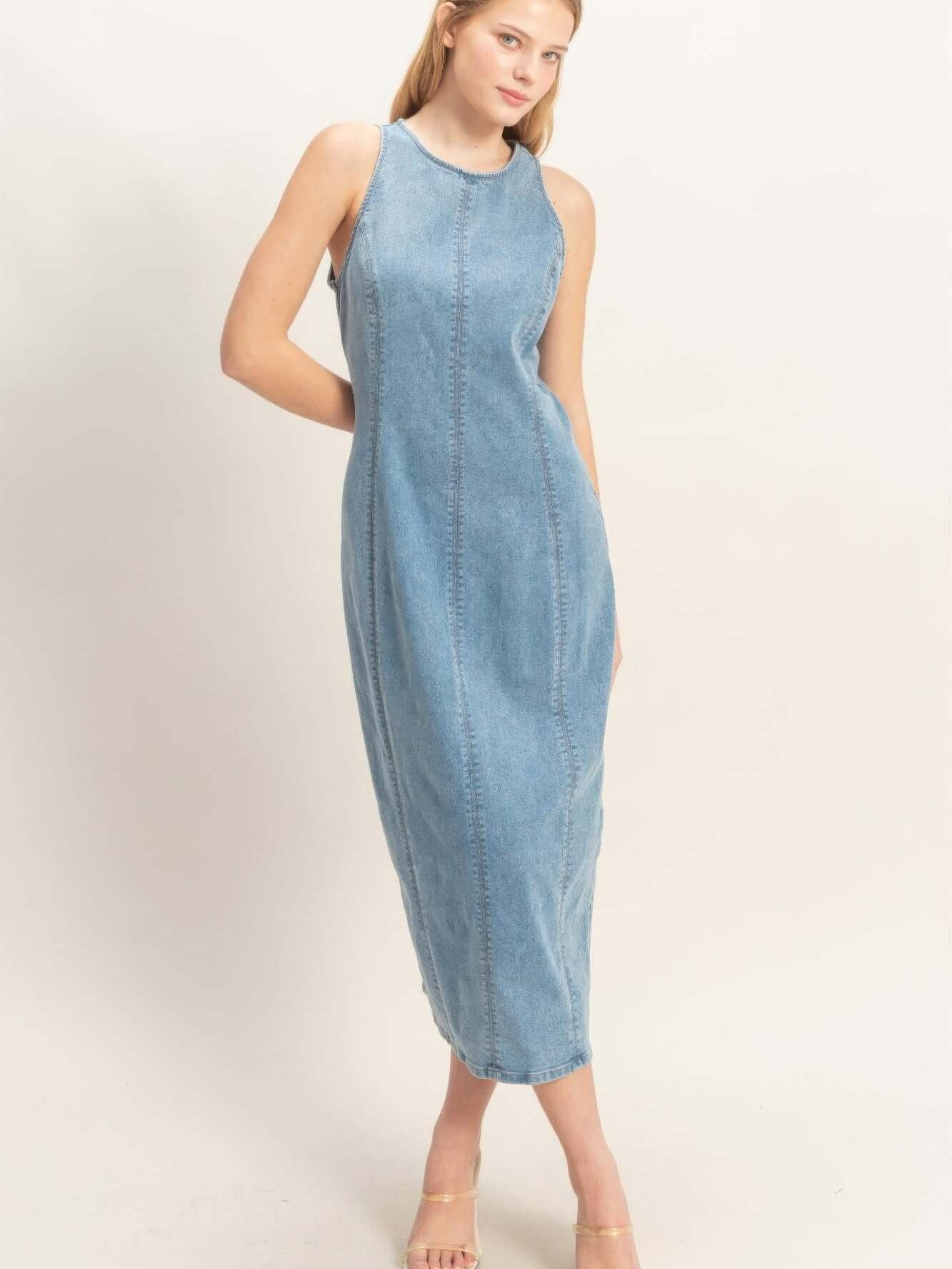 Sleeveless Denim Midi Dress model showcasing a stylish denim midi dress with a refined silhouette.