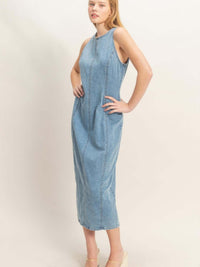 Model wearing a Sleeveless Denim Midi Dress, showcasing its modern design and comfortable fit.