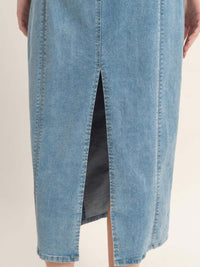 Back view of Sleeveless Denim Midi Dress showcasing the slit detail and soft blue fabric.