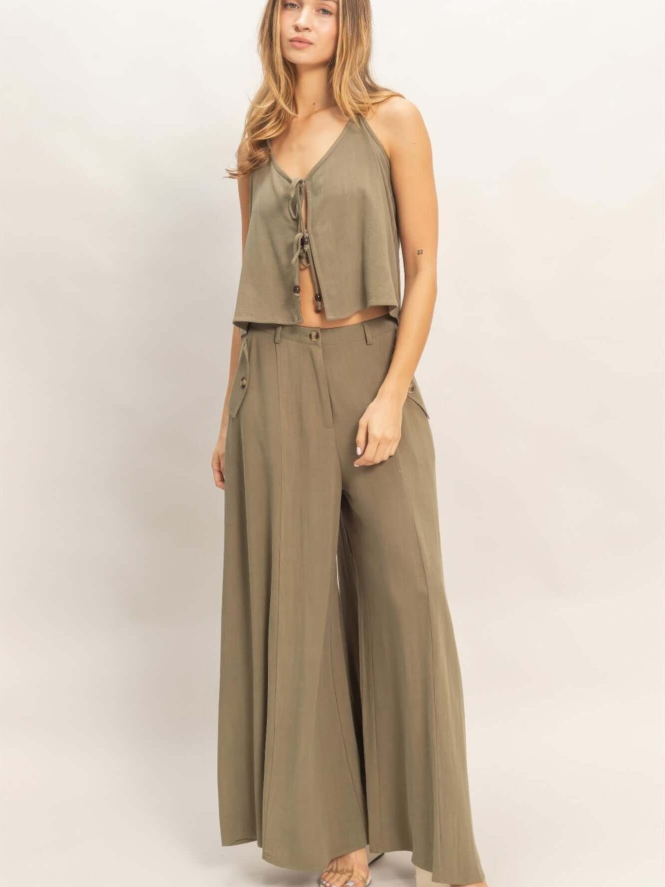 Wide-leg Flap Pocket Pants modeled with a matching cropped top in a stylish olive green outfit.