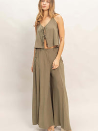 Wide-leg Flap Pocket Pants modeled with a matching cropped top in a stylish olive green outfit.