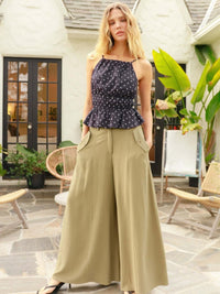Wide-leg Flap Pocket Pants paired with a stylish polka dot top in a bright outdoor setting.