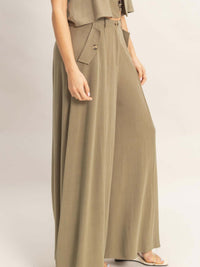 Wide-leg Flap Pocket Pants featuring a structured silhouette and breathable rayon-linen blend fabric.