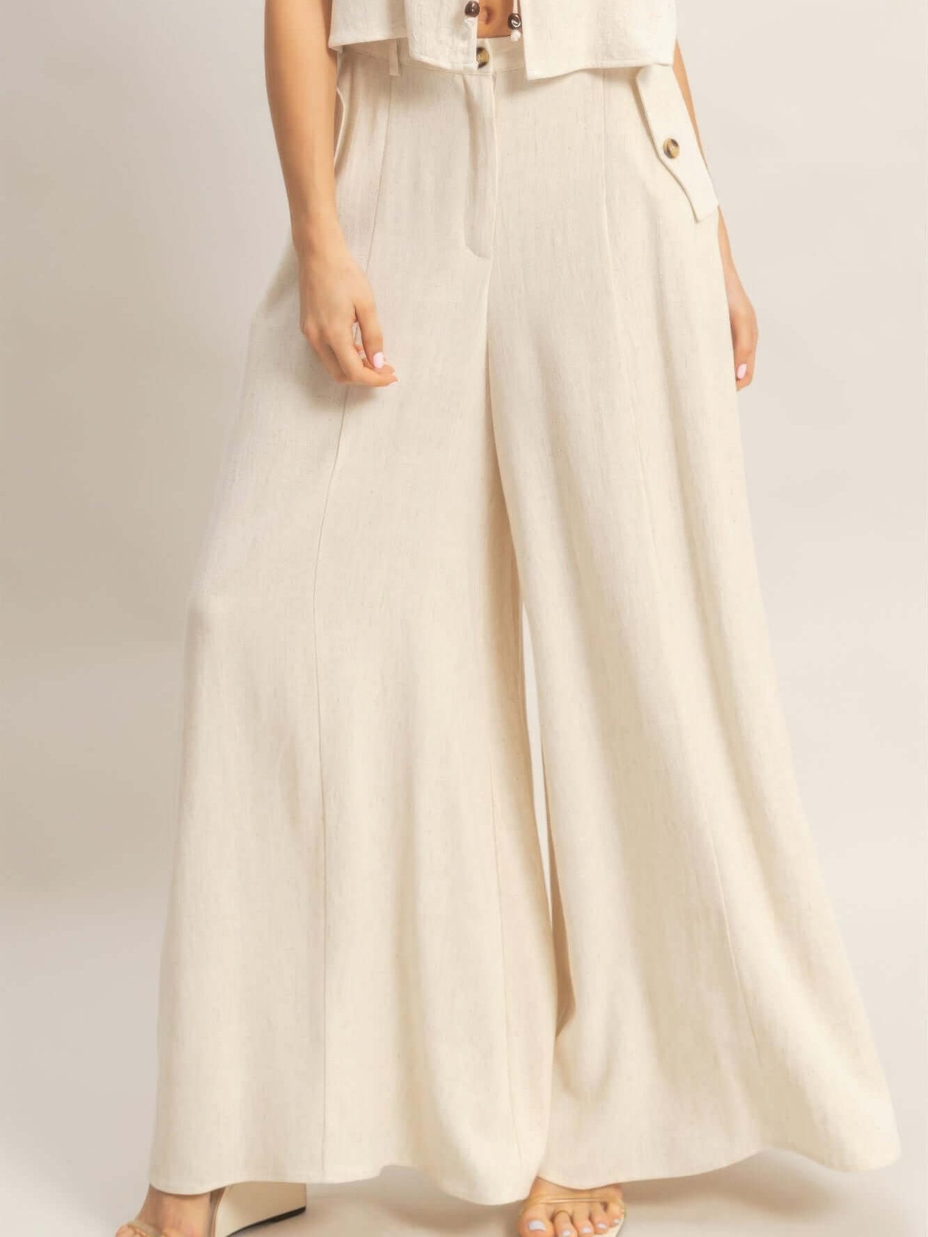 Wide-leg Flap Pocket Pants featuring a breathable rayon-linen blend and stylish flap pockets.