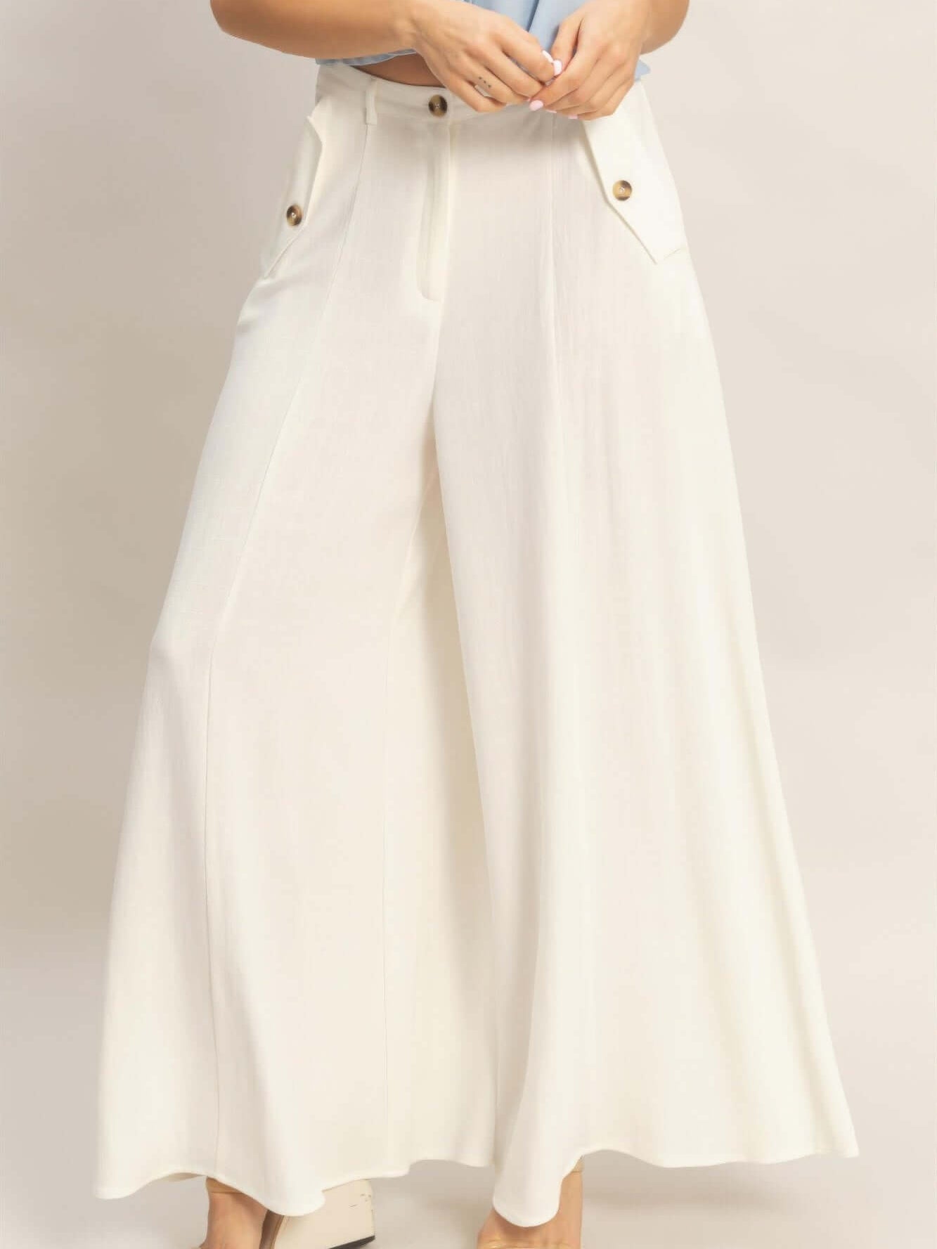 Wide-leg Flap Pocket Pants displayed on model, showcasing a stylish and polished look.