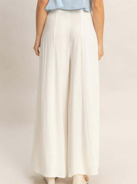 Wide-leg Flap Pocket Pants featuring a back view showcasing the flowing silhouette and elegant design.