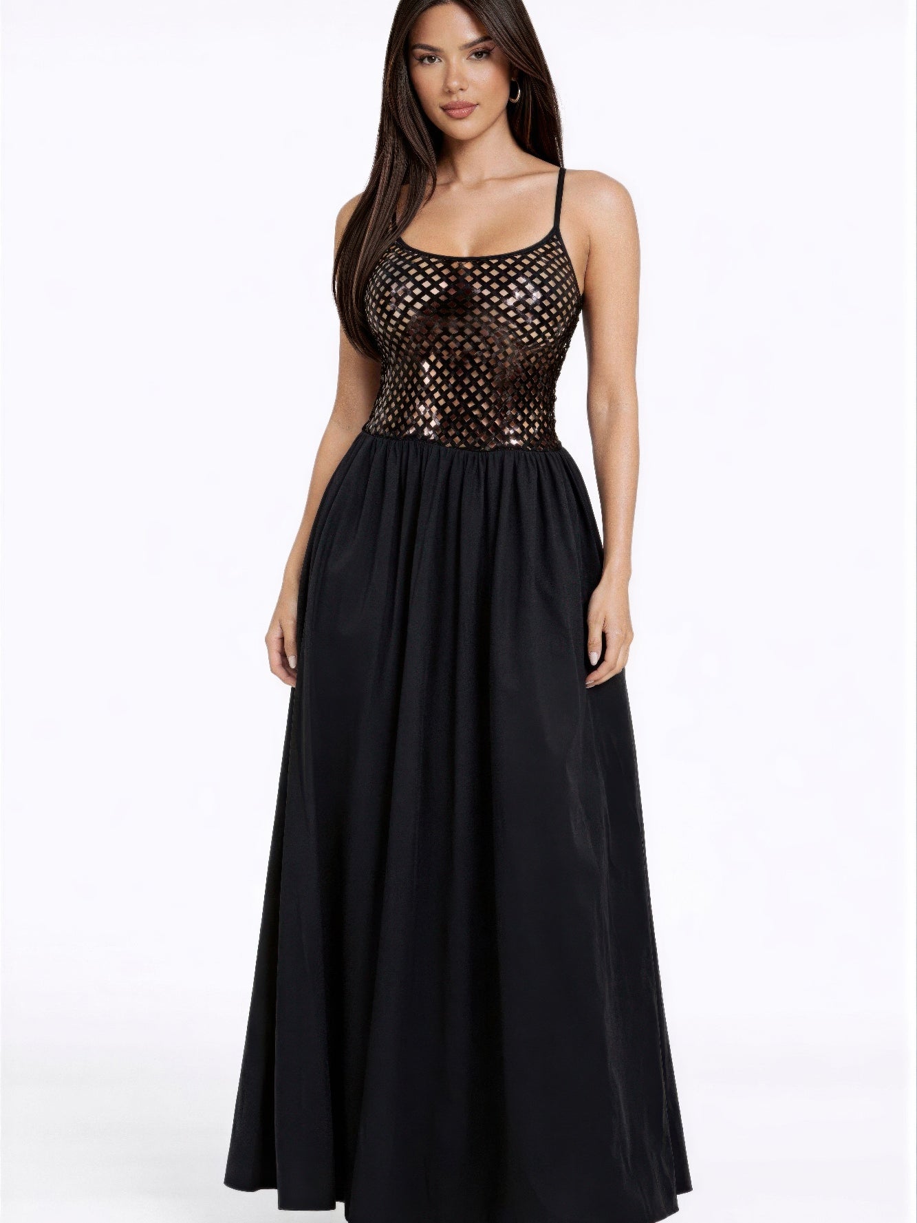 Model wearing a Netted Sequin Maxi Dress with a shimmering bodice and flowing black skirt, ideal for elegant events.