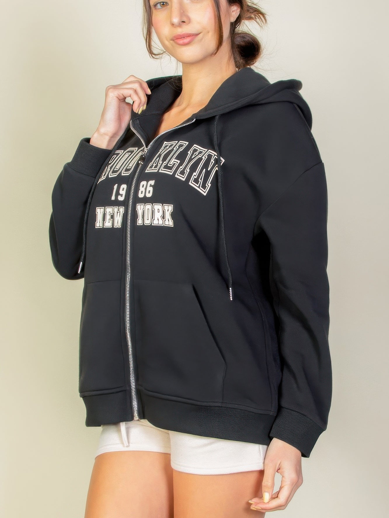 Graphic drop shoulder zipper hoodie featuring Brooklyn logo, perfect for casual style and comfort.