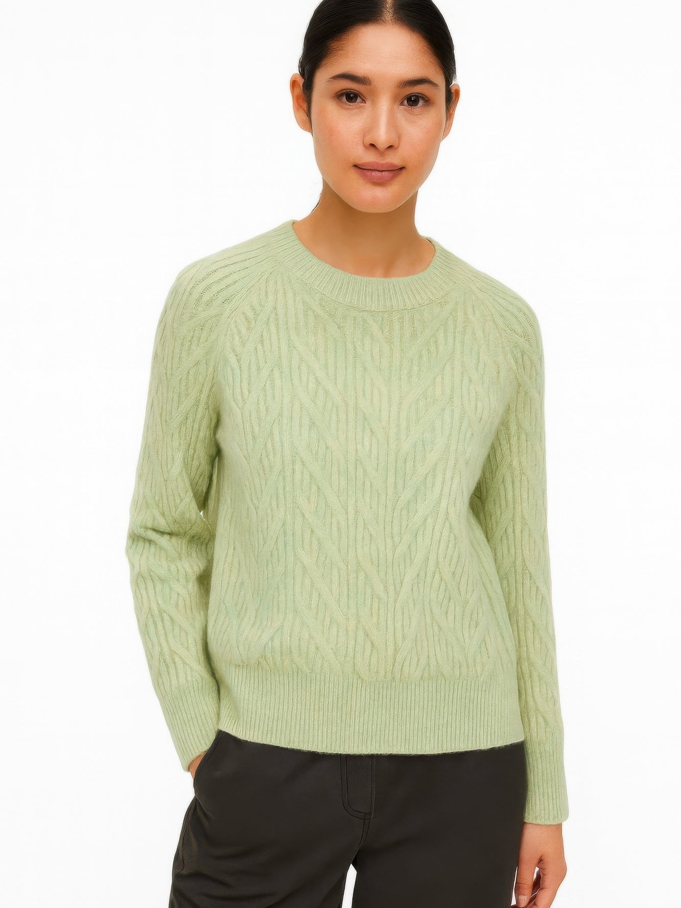 The Maple Braided Cable Sweater in light green, front view